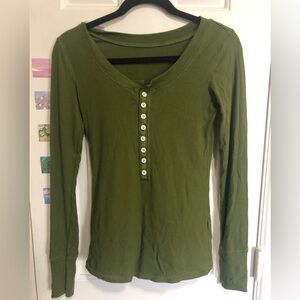 Green Henley top.